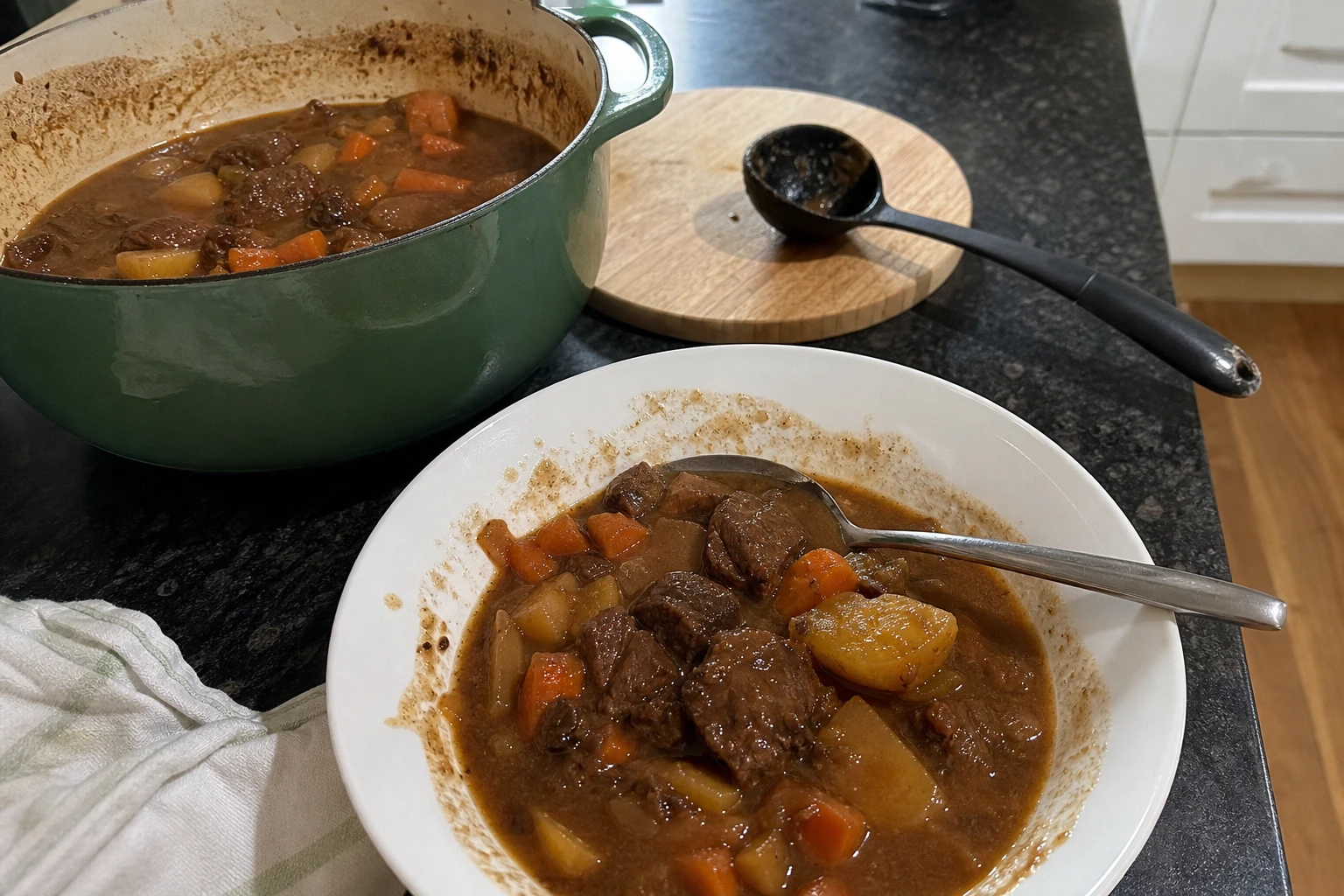 A hearty pot of Beef and Guinness Stew on the stove, bubbling away