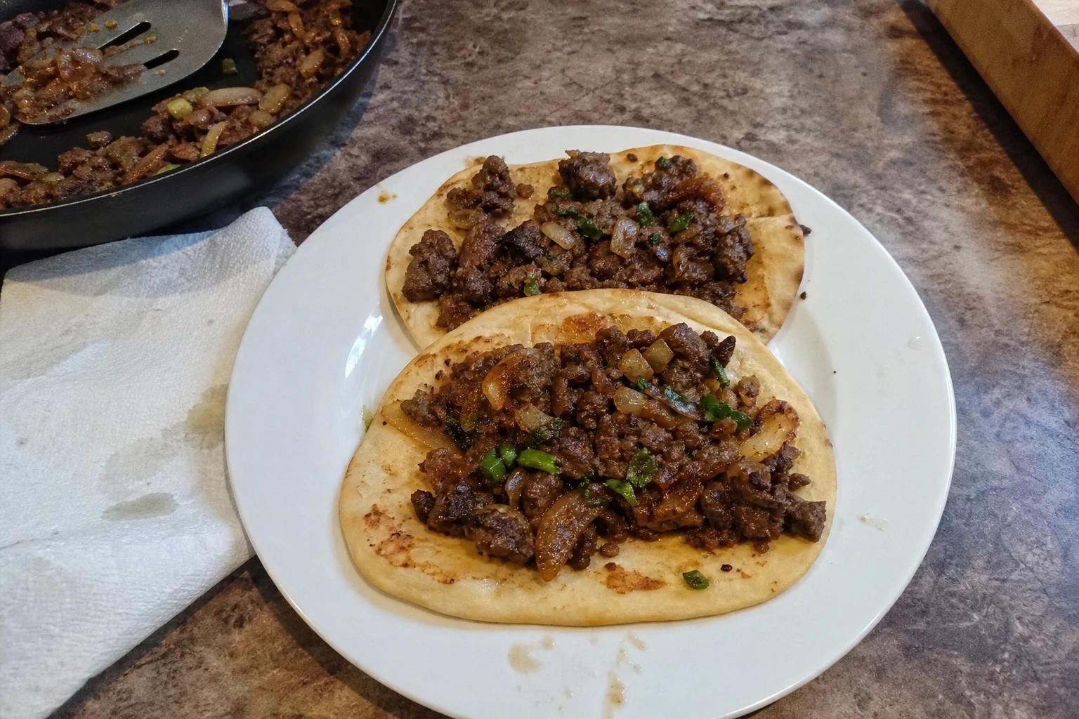 Colorful ingredients for Beef Flatbreads laid out on a table