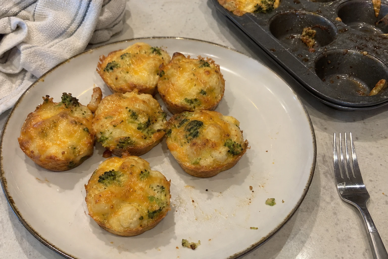 Close-up of the creamy interior of a cheesy broccoli cup