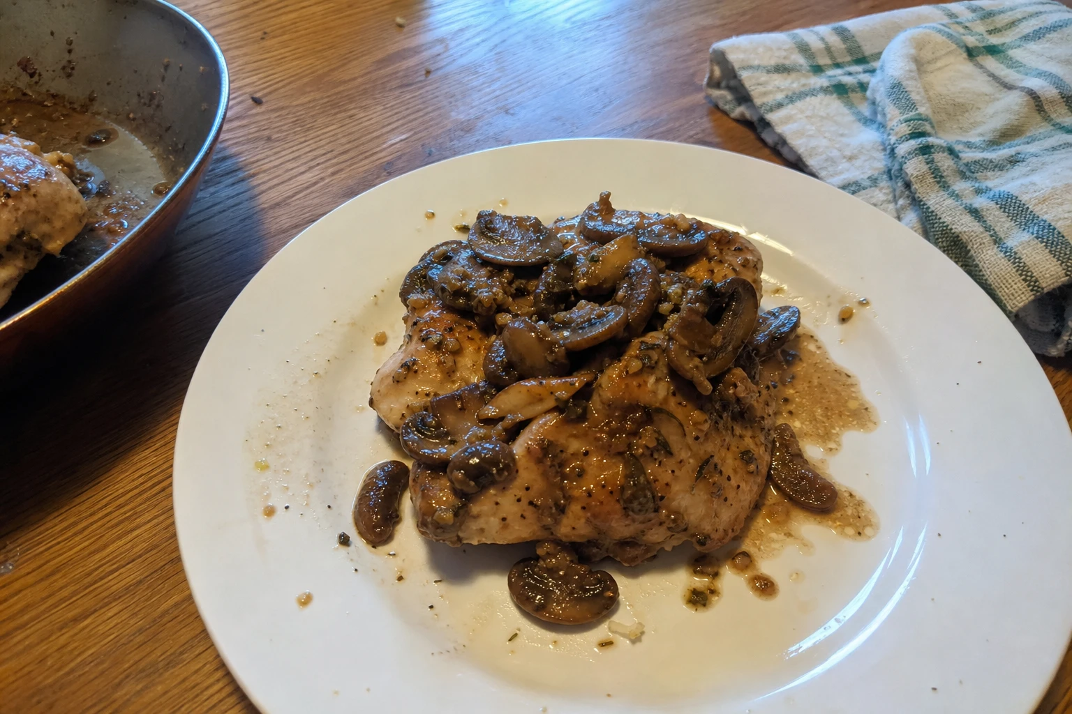 Close-up of tender chicken thighs topped with saut