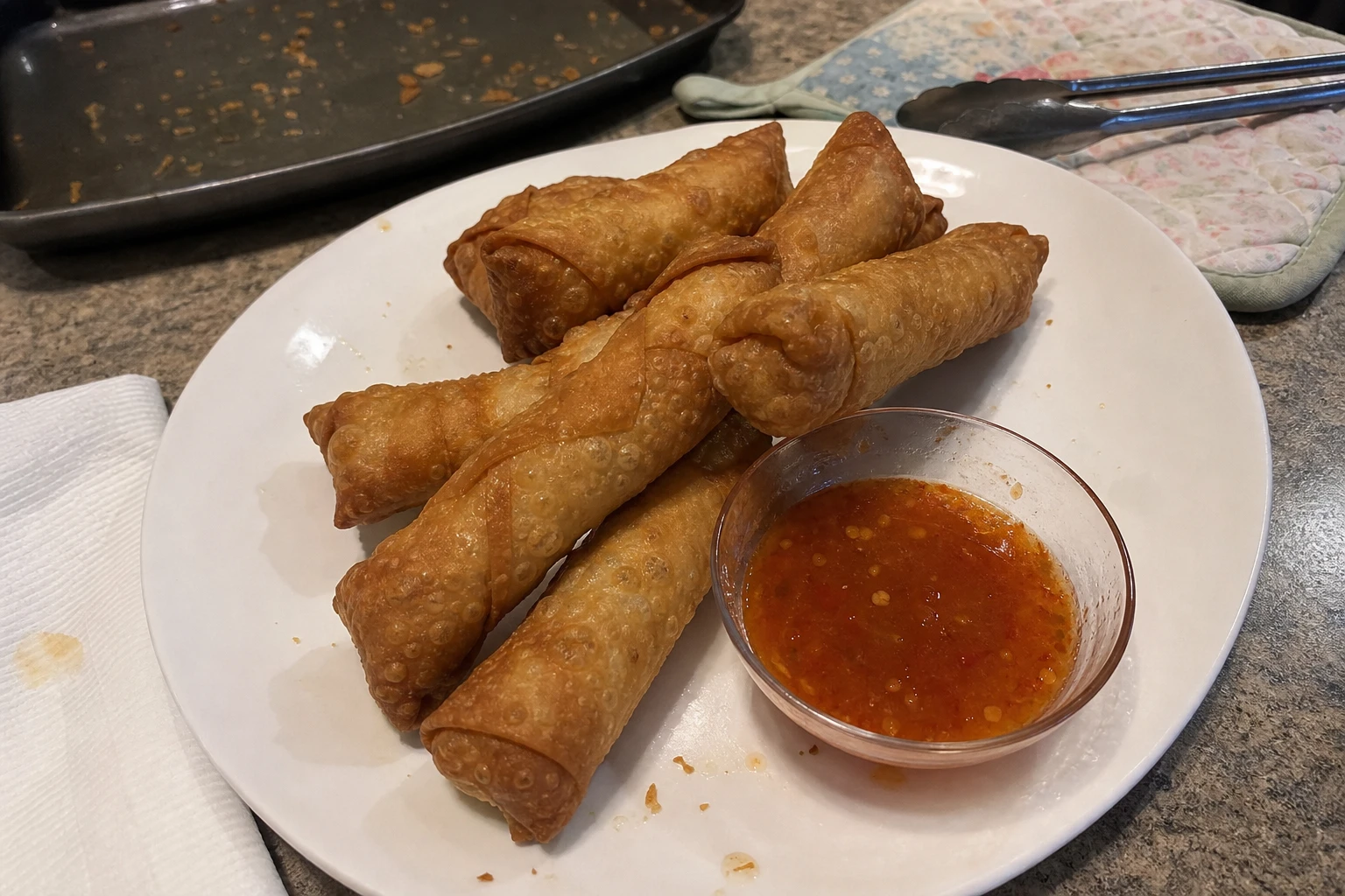 Close-up of firecracker egg rolls showing the filling