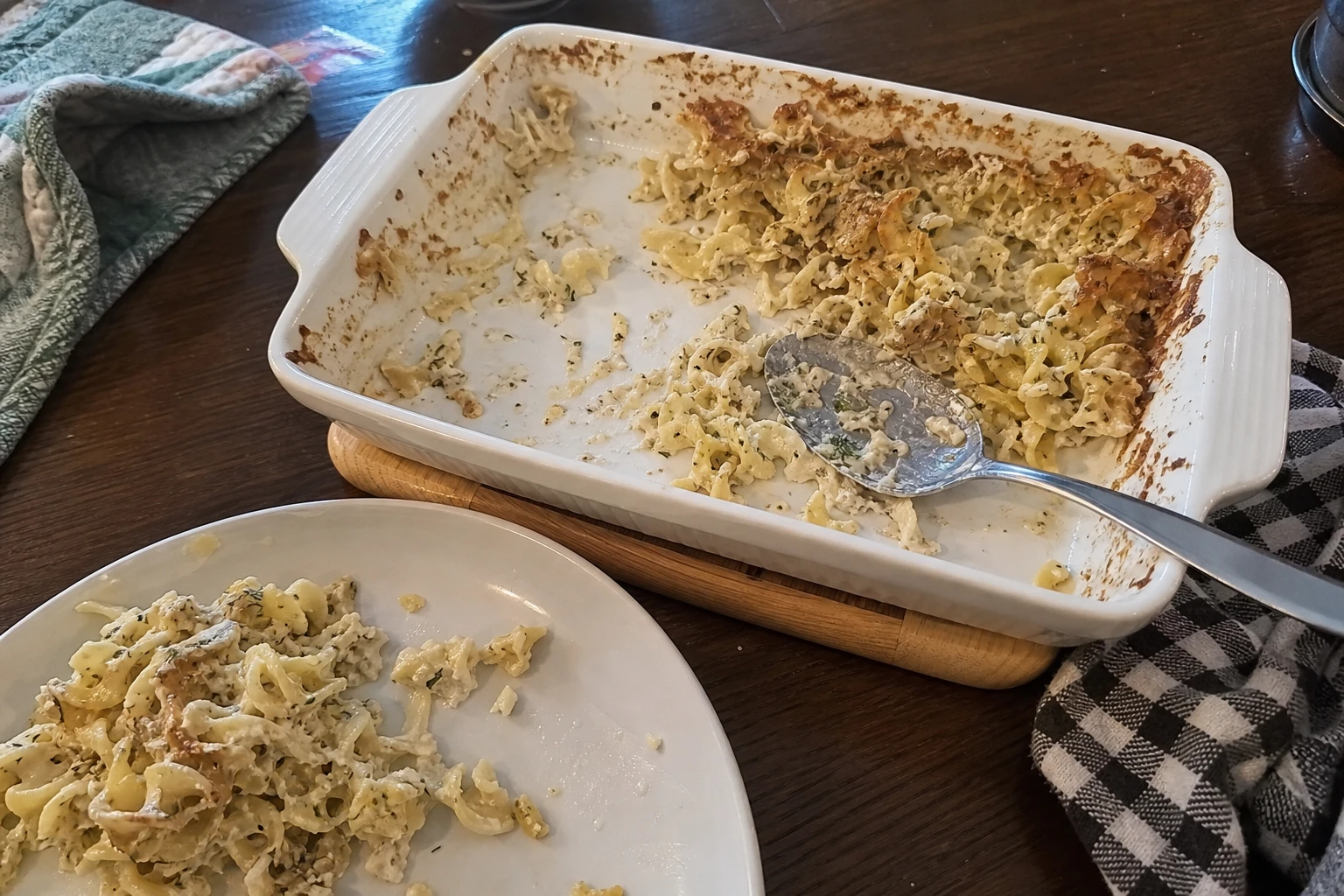 Close-up of the egg noodles layered with creamy sauce and fresh dill topping.