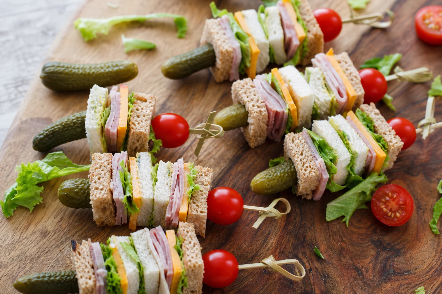 Close-up of a kabob with turkey, cheese, and veggies