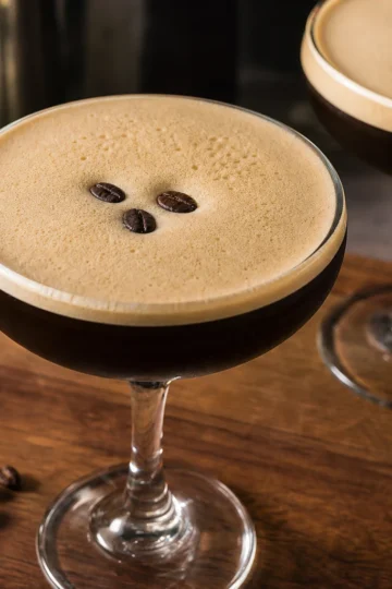 Espresso martini in a glass with coffee beans on top