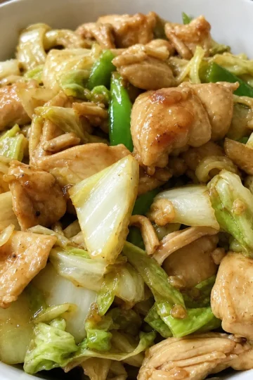 Colorful chicken cabbage stir-fry in a pan